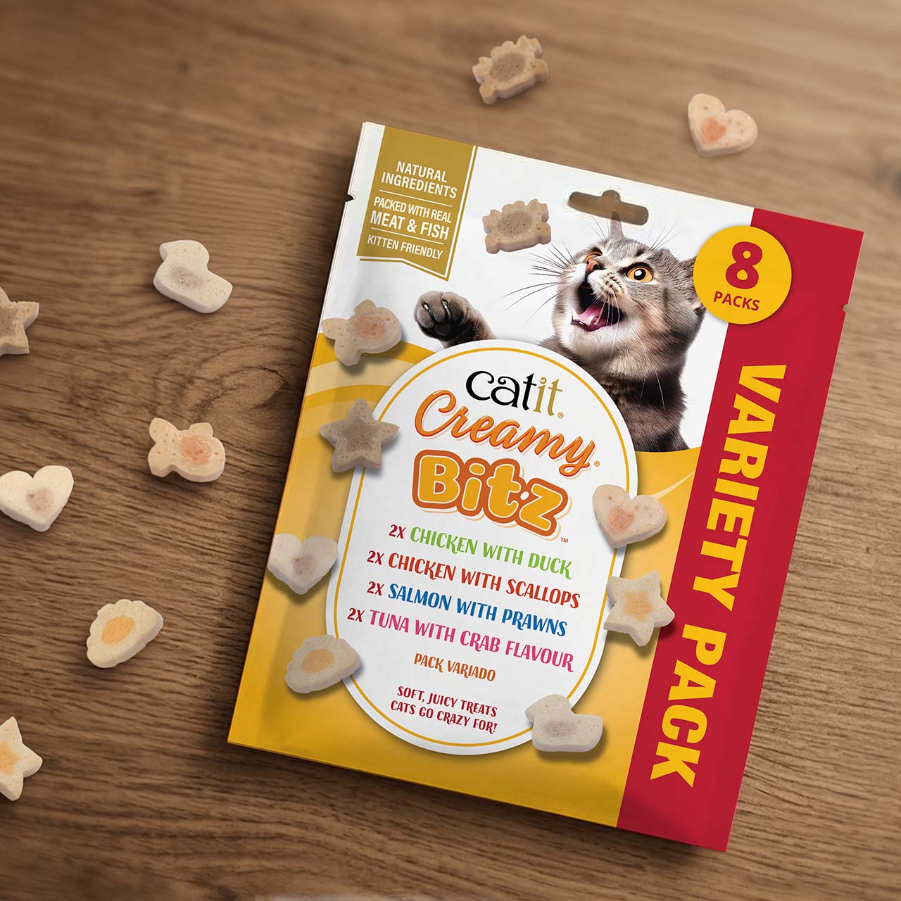 Catit Creamy Bitz Multi pack packaging laying on wooden countertop