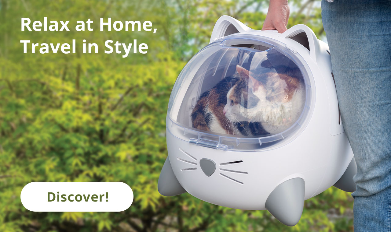 Relax at Home, Travel in Style - Catit PIXI Mio in with outdoor background, person holding the PIXI Mio carrier