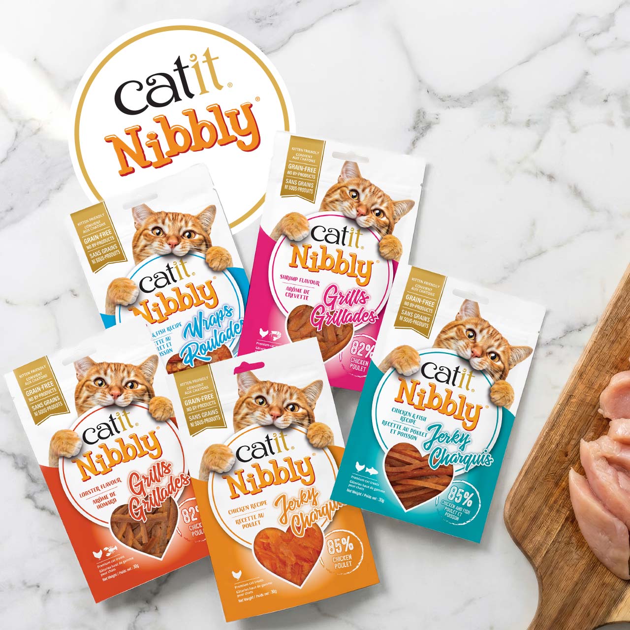 Catit Nibbly cat treat packaging in various flavors including chicken, fish, prawn, and lobster